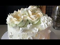 there is a white cake with flowers on it