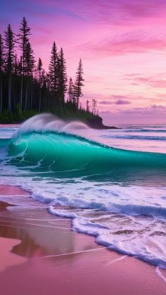 an ocean wave is breaking on the beach at sunset with pine trees in the background