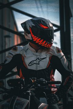 a person wearing a helmet and riding a motorcycle