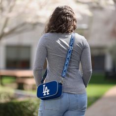 At the game. In the crowd. On the go. Youĺve got team spirit in the bag (along with the rest of your stuff) with this Los Angeles Dodgers Team Stripe Crossbody Bag. Features All-over team-colored design that makes carrying your stuff to the game a breeze Bold team logo display, in case there were any doubts where your allegiances lie Woven, team-colored crossbody strap that makes carrying the team easy and convenient Repeat script team name display on strap for a little extra team spirit Full-zi Blue Logo Crossbody Bag, Dodgers Gear, Logo Display, In The Bag, Team Name, Los Angeles Dodgers, Team Names, Crossbody Strap, Team Spirit