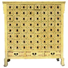 an old chinese style cabinet with many drawers