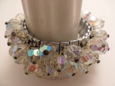 Such a beautiful festive bracelet! Vintage 50's crystals that are faceted and reflect a lot of colorful sparkles. on a strech silver metal bracelet fits many sizes. 1950's classic very well made piece of jewelry. beautiful! Party Stretch Bracelet With Faceted Beads, Party Stretch Bracelet With Rhinestones, Silver Faceted Crystal Bracelet For Party, Silver Stretch Bracelet With Faceted Beads For Party, Adjustable Vintage Stretch Bracelet For Party, Vintage Adjustable Stretch Bracelet For Party, Jewelry Beautiful, Metal Bracelet, Bezel Pendant