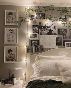 a white bed topped with lots of pictures and lights