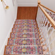 the stair treads are decorated with colorful rugs