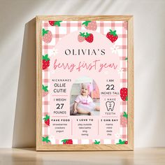 a baby's first year photo frame with strawberries on it