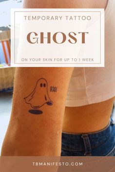 a woman's arm with the words temporary tattoo ghost on it