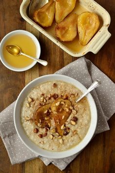 a bowl of oatmeal with fruit and nuts