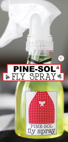 a bottle of pine - sol fly spray sitting on top of a table