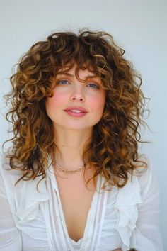 Woman with naturally curly hair styled in a layered cut, adding volume and definition Curly Layered Hairstyles, Modern Layered Haircuts, Best Layered Haircut, Texture Layers, Layered Hairstyles, Haircut Inspiration, Layered Haircut, Saving Ideas, Hair Length