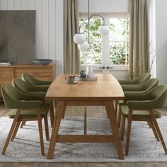 a dining room table with six chairs around it