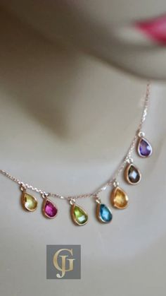 Celebrate your unique Zodiac sign or surprise a loved one with this stunning Multigemstone Rose Gold Teardrop Necklace. Featuring the vibrant colors of Citrine, Pink Sapphire, Peridot, Blue Topaz, Lemon Quartz, Smoky Quartz, and Amethyst, this beautiful birthstone necklace is the perfect accessory for any occasion. Find out more about the meaning behind each stone, and learn how you can personalize it to create a truly one-of-a-kind keepsake. Elegant Multicolor Birthstone Jewelry, Elegant Multi-stone Drop Necklaces, Elegant Multicolor Drop Jewelry, Elegant Multicolor Teardrop Pendant Jewelry, Multicolor Pear-shaped Gemstone Jewelry, Fine Jewelry Drop Gemstones As A Gift, Elegant Teardrop Birthstone Gemstones, Pear-shaped Multi-stone Jewelry Gift, Pear-shaped Multi-stone Jewelry For Gifts