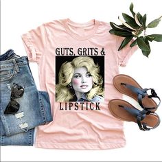 a t - shirt that says guts, grits and lipstick on it next to some jeans