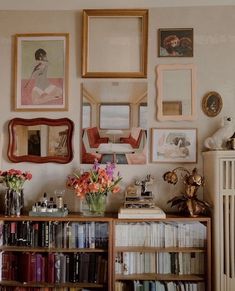 a bookshelf filled with lots of books and pictures