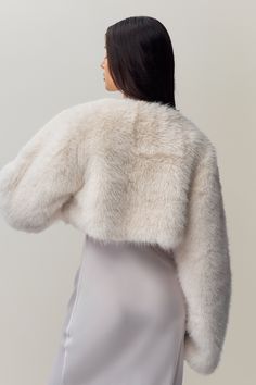 Introducing our new Alyana Faux Fur Jacket, the perfect topper for your favorite dress. This ultra-soft, plush coat adds a touch of glam to any outfit while keeping you warm and stylish. Its cropped length is designed to flatter, making it the ideal piece to throw on for a night out or a special occasion. Fabrication: Luxe Faux Fur; 100% Polyester Sonali is wearing a size S and is 5'10" with a 31" bust, 35" hips, and 23" waist Wedding Dress With Fur Coat, Dress With Fur Coat, Short Fur Coat, Faux Fur Shrug, Faux Fur Cardigan, Plush Coat, White Faux Fur, Faux Fur Jacket, Fur Jacket