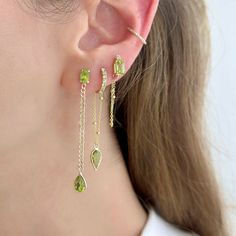 These double gemstone chain earrings feature a stunning design crafted from 14 karat gold, exuding elegance and sophistication. Each earring comprises two gemstones linked by a delicate chain, creating a graceful, sexy, dangle effect. Peridot Gemstone, Sell Gold, Delicate Chain, Cuban Chain, Chain Earrings, Design Crafts, Yellow Gold, Gemstones, Chain