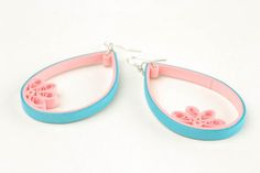 two pairs of earrings with pink and blue details