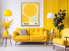 a living room with yellow furniture and white carpeted flooring, walls painted bright yellow