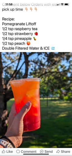 someone holding up a drink in front of a tree with the caption, pick me up time