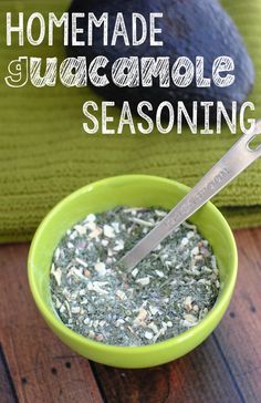 homemade guacamole seasoning in a green bowl with a spoon on the side