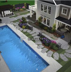 an aerial view of a house with a pool in the yard and landscaping around it