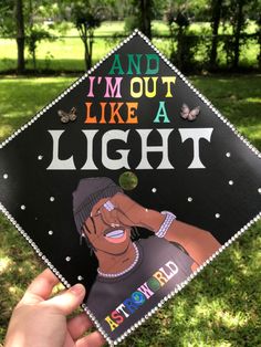 someone holding up a graduation cap that says and i'm out like a light