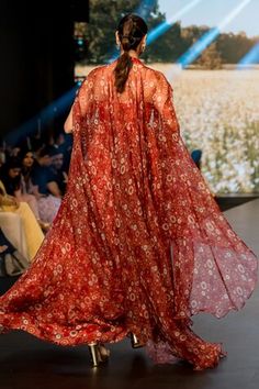 Red corset style gown with floral print and embroidery on the yoke. Paired with an asymmetric embroidered cape. - Aza Fashions Red Silk Dress With Sheer Dupatta, Designer Lehenga With Floral Embroidery And Cape Sleeves, Semi-stitched Embroidered Anarkali Set With Cape Sleeves, Red Maxi Dress With Sheer Dupatta, Designer Embroidered Red Kaftan, Wedding Dress With Floral Print And Cape Sleeves, Red Silk Floor-length Gown, Floral Print Wedding Dress With Cape Sleeves, Designer Embroidered Cape Sets