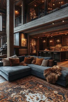 Add a touch of luxury to rustic cabin style with plush furniture, elegant lighting, and soft textiles for a chic, cozy feel. Ideal for curling up by the fire in style. Click here for more chic cozy cabin ideas. Timber Cabin Interior, Cabin Core Living Room, Alpine Lodge Interior, Adirondack Interior Design, Cabin Foyer Entrance, Chalet Style Living Room, Cedar Cabin Interior Design, Hunting Cabin Living Room, Modern Cabin Home Decor