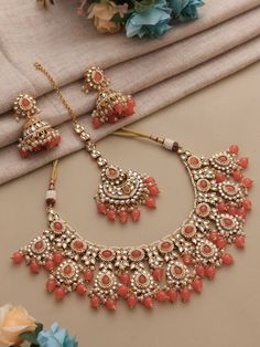 Adorn yourself in timeless elegance with this exquisite Peach orange Kundan necklace set, perfect for weddings and special occasions. Crafted with meticulous attention to detail, the set features delicate peach orange hues reminiscent of Pakistani and Punjabi traditions, with a touch of Bollywood glamour. Complete with matching earrings and a stunning maangtika, this Indian Kundan ensemble effortlessly captures the essence of sophistication and grace. Measurements:  Weight- 90 gms  Necklace Leng Orange Kundan Traditional Wear, Luxury Traditional Orange Jewelry, Orange Indian Jewellery Set, Diwali Kundan Bridal Necklace, Peach Jewellery Set, Orange Jewelry Set, Bollywood Glamour, Blue Wedding Jewelry, Kundan Necklace Set