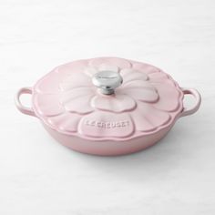 a pink casserole dish on a white table