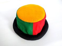 This Rasta Jamaican Bucket hat is perfect for Summer Reggae Festivals. This solid Bucket hat features a Jamaican Rasta Inspired Striped Band atop a solid , Red green yellow Rasta color bucket hat. Rock this hat as you dance the night away at your next outdoor concert or event. Fashionable and a must-have . This Hat is unisex that looks great on both men and women . This Hat is very durable and can be used as a special gift . -Solid Unisex Jamaican Adult Sun Hat -Rasta Reggae Inspired Striped Ban Adjustable Multicolor Costume Cap, Multicolor Adjustable Cap, Adjustable Multicolor Bucket Mini Hat, Adjustable Multicolor Brimmed Mini Hats, Adjustable Multicolor Mini Bucket Hat, Multicolor Short Brim Mini Hat, Multicolor Short Brim Hat, Adjustable Multicolor Brimmed Costume Hats And Headpieces, Adjustable Multicolor Wide Brim Costume Hats