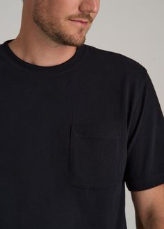 The Ultimate Pocket Tee for Tall Men Relax in Style Think you can't find a tee that fits just right? Think again! Our Workwear Pocket T-Shirt is all about giving tall guys like you the perfect fit and feel. With its relaxed vibe and hip-length cut, this men's tall t-shirt is great whether you're tucking it in or hanging loose. Sturdy yet comfy, and that handy chest pocket? It's just waiting to keep your essentials safe, making this tall tee ideal for those laid-back days or a casual catch-up wit Everyday Black Pre-shrunk Shirt, Basic Relaxed Fit T-shirt With Pockets, Relaxed Fit T-shirt With Side Pockets, Relaxed Fit T-shirt With Pockets For Workwear, Relaxed Fit Crew Neck T-shirt With Side Pockets, Black Relaxed Fit Functional T-shirt, Athleisure Summer, Scrubs Dress, Cozy Sleepwear