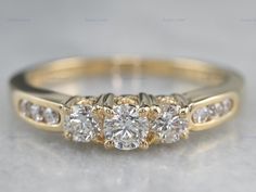 three stone diamond ring setting in yellow gold