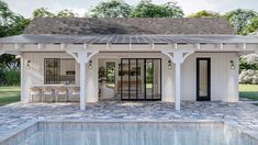 a small house with a pool in the front yard and covered patio area next to it