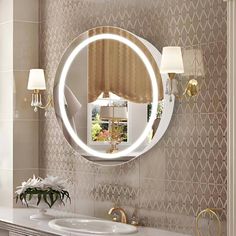 a bathroom with a round mirror on the wall