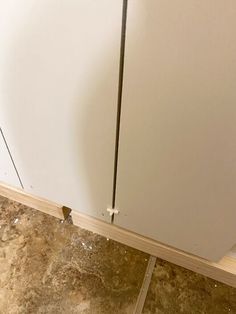 the corner of a kitchen cabinet that has been stripped off and is being worked on