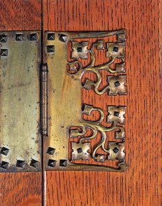 a close up of a wooden door with metal latch