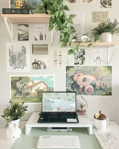 a laptop computer sitting on top of a white desk next to a keyboard and mouse