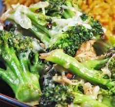 broccoli and other vegetables on a plate with rice