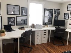 a home office with pictures on the wall