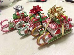 several wrapped presents are stacked on top of each other with ribbons and bows around them