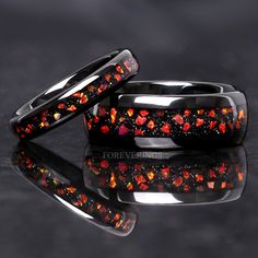 ►Material: Tungsten Carbide and Crushed Red Fire Opal Inlay ►Color: Red Nebula Inspired ►Comfort Fit ►His Band Width: 8mm ►Her Band Width: 4mm ►Fit is true to size for Her band (4mm). ►Fit is slightly loose for His band (8mm), but should order as true to size. If you are between sizes, recommend going down to the next closest size for His band (8mm). ►This ring is inspired by the beautiful red nebula shown above. The red opal stones resemble gases of the nebula amongst a sea of stars. A beautifu Red And Black Wedding Ring, Wedding Rings Sets His And Hers Red, Black And Red Rings, Black And Red Wedding Rings For Women, Blacm And Red Wedding Ring, Red Nebula, Gothic Fairytale, Couples Bracelets, Red Opal