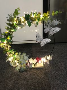 a wreath made out of leaves and lights