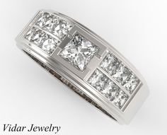 a white gold ring with princess cut diamonds