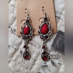 An Elegant Pair Of Fashion Earrings In A Ruby Red Color With A Silvertone Marcasite Victorian Look. Excellent Condition, Never Worn. 2.5" From Hook To Bottom. Please View All Photos I Have Listed. Thanks For Looking And Be Sure To Check Out My Other Listings For More Great Items! Ruby Jewelry Silver, Red Elegant Nickel-free Teardrop Earrings, Red Metal Drop Earrings, Red Metal Dangle Earrings, Red Nickel-free Teardrop Dangle Earrings, Nickel-free Red Earrings For Party, Vampire Outfit, Vampire Oc, Goth Things