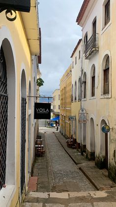 an alley way with several buildings on both sides