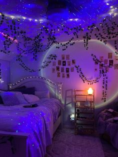 a bedroom decorated with purple lights and decorations