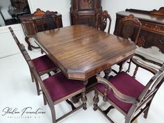 a wooden table with purple chairs around it