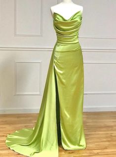 Chic in its design, does this gown not beckon the bold and the beautiful? The radiant chartreuse satin, structured yet fluid, flows down in a tailored fit that speaks of haute couture's precision. The bodice, with its artful ruching, accents the natural lines of the figure, while the expansive skirt and train provide a dramatic counterbalance, full of movement. The minimalist approach to the gown allows the vibrant color and exquisite fabric to take center stage, making it the ideal choice for those who wish to embody elegance with a touch of contemporary flair.Silhouette:mermaidHemline:floor lengthNeckline:straplessFabric:satinShown Color:greenSleeve Style:sleevelessBack Style:zipper upEmbellishment:pleatsBuilt-in Bra: yes Tianas Closet, Prom Dresses Long Pink, Long Formal Gowns, Evening Dress Floor Length, Prom Dresses Vintage, Mermaid Style, A Line Prom Dresses, Satin Prom Dress, Mermaid Gown