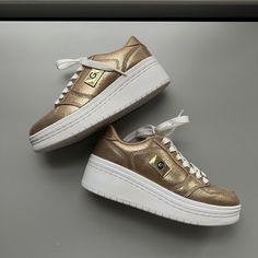 G By Guess Sneakers. Gold Color. Brand New. Soft And Comfortable. Casual Gold Low-top Platform Sneakers, Sporty Gold Platform Sneakers With Round Toe, Gold Low-top Platform Sneakers, Gold Platform Sneakers With Round Toe, Gold Low-top Sporty Platform Sneakers, Sporty Platform Sneakers With Metallic Logo, Casual Gold Sneakers With Metallic Logo, Gold Casual Sneakers With Metallic Logo, Gold Glitter Shoes