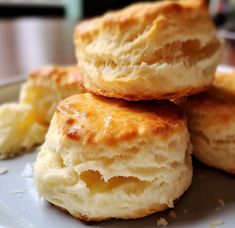 three biscuits stacked on top of each other on a plate